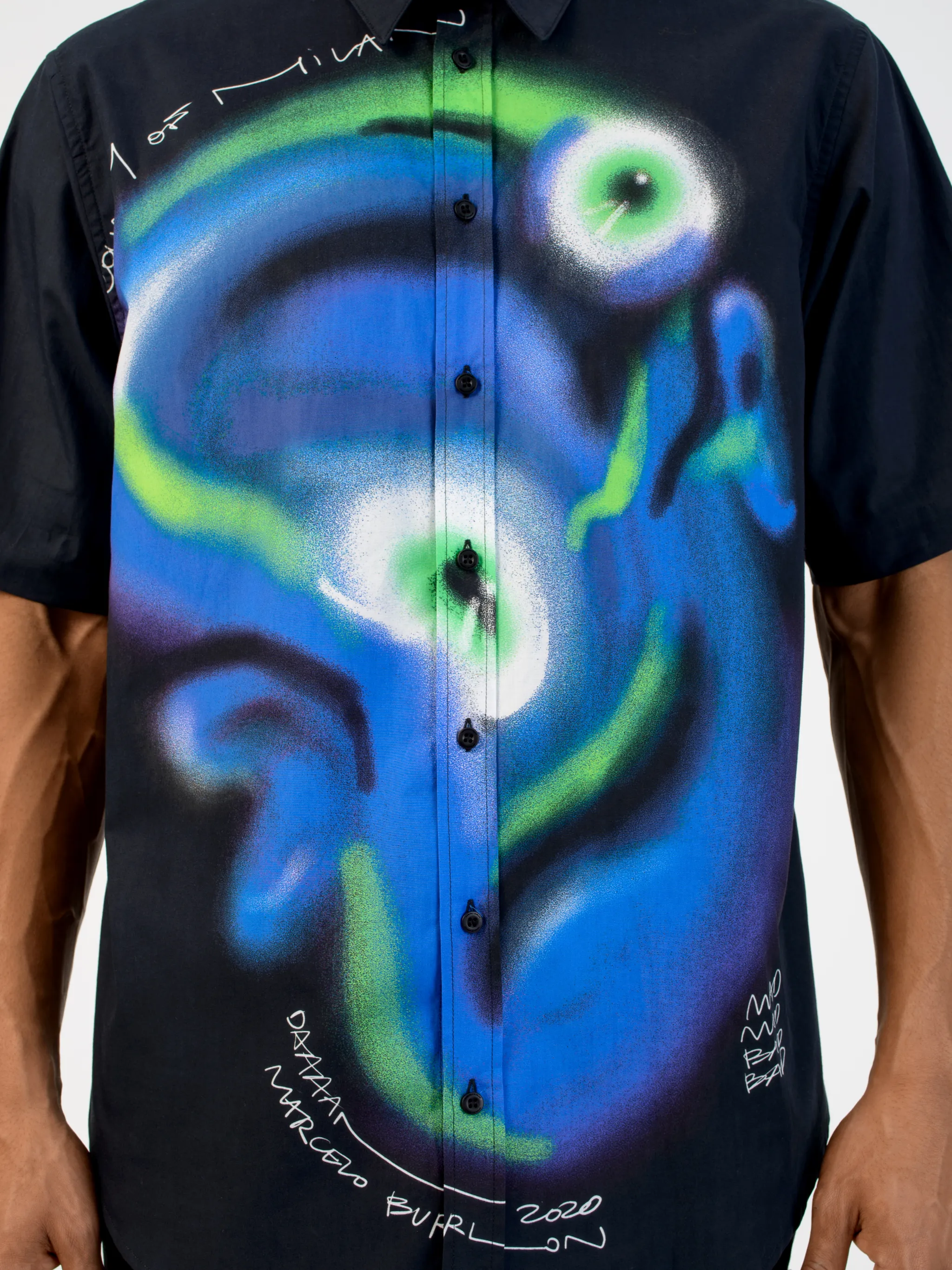 Black/multicolour cotton Mad Face graphic print shirt from Marcelo Burlon County of Milan featuring graphic print, straight-point collar, front button fastening, short sleeves and straight hem.