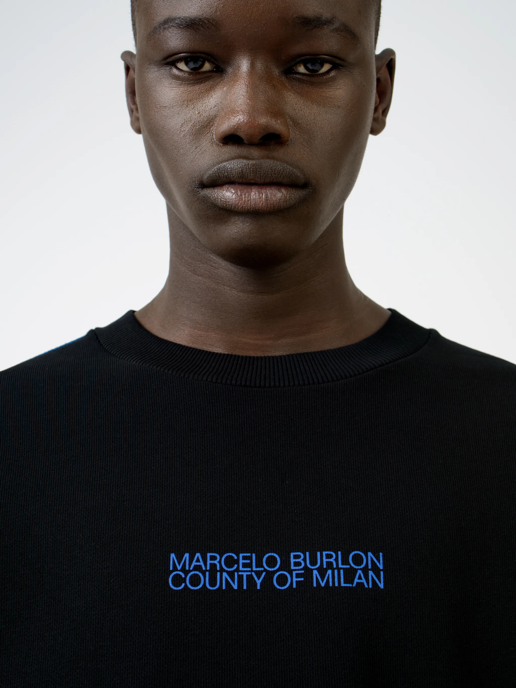 Black cotton Mad Face crew-neck sweatshirt from Marcelo Burlon County of Milan featuring logo print at the chest, graphic print to the rear, contrasting trim, crew neck, long sleeves and straight hem.
