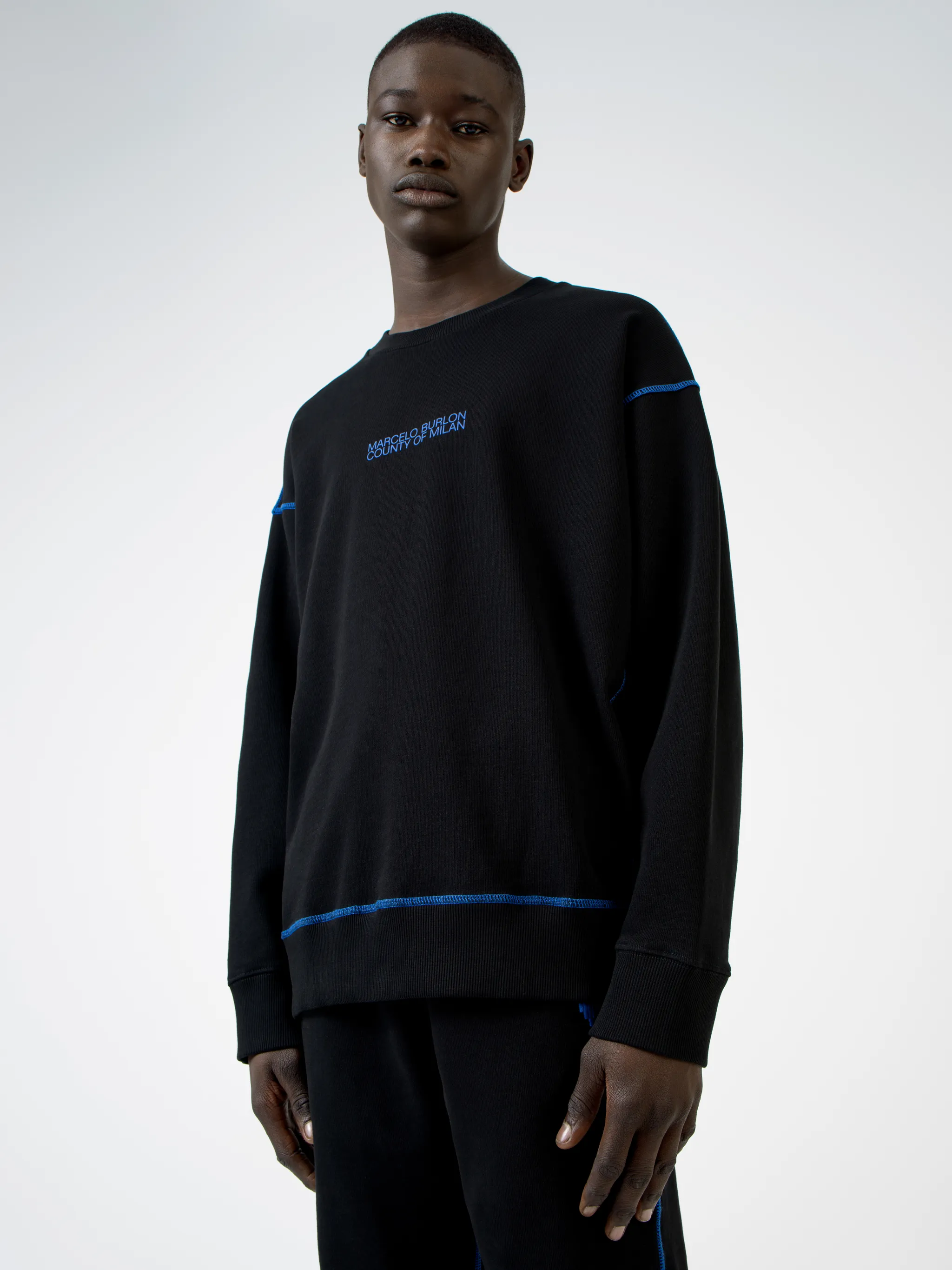 Black cotton Mad Face crew-neck sweatshirt from Marcelo Burlon County of Milan featuring logo print at the chest, graphic print to the rear, contrasting trim, crew neck, long sleeves and straight hem.