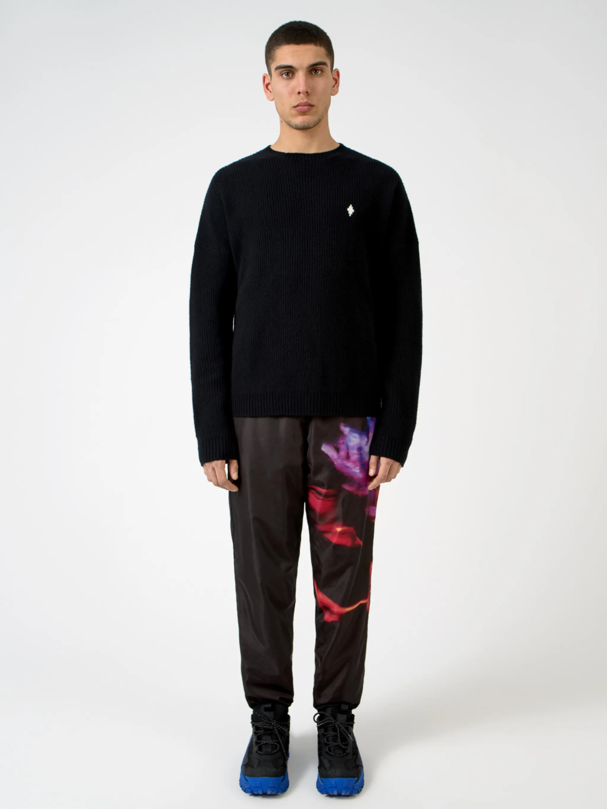 Black wool MBCM ribbed-knit wool jumper from Marcelo Burlon County of Milan featuring chunky ribbed knit, embroidered logo at the chest, embroidered logo to the rear, ribbed edge, crew neck, long sleeves and straight hem.