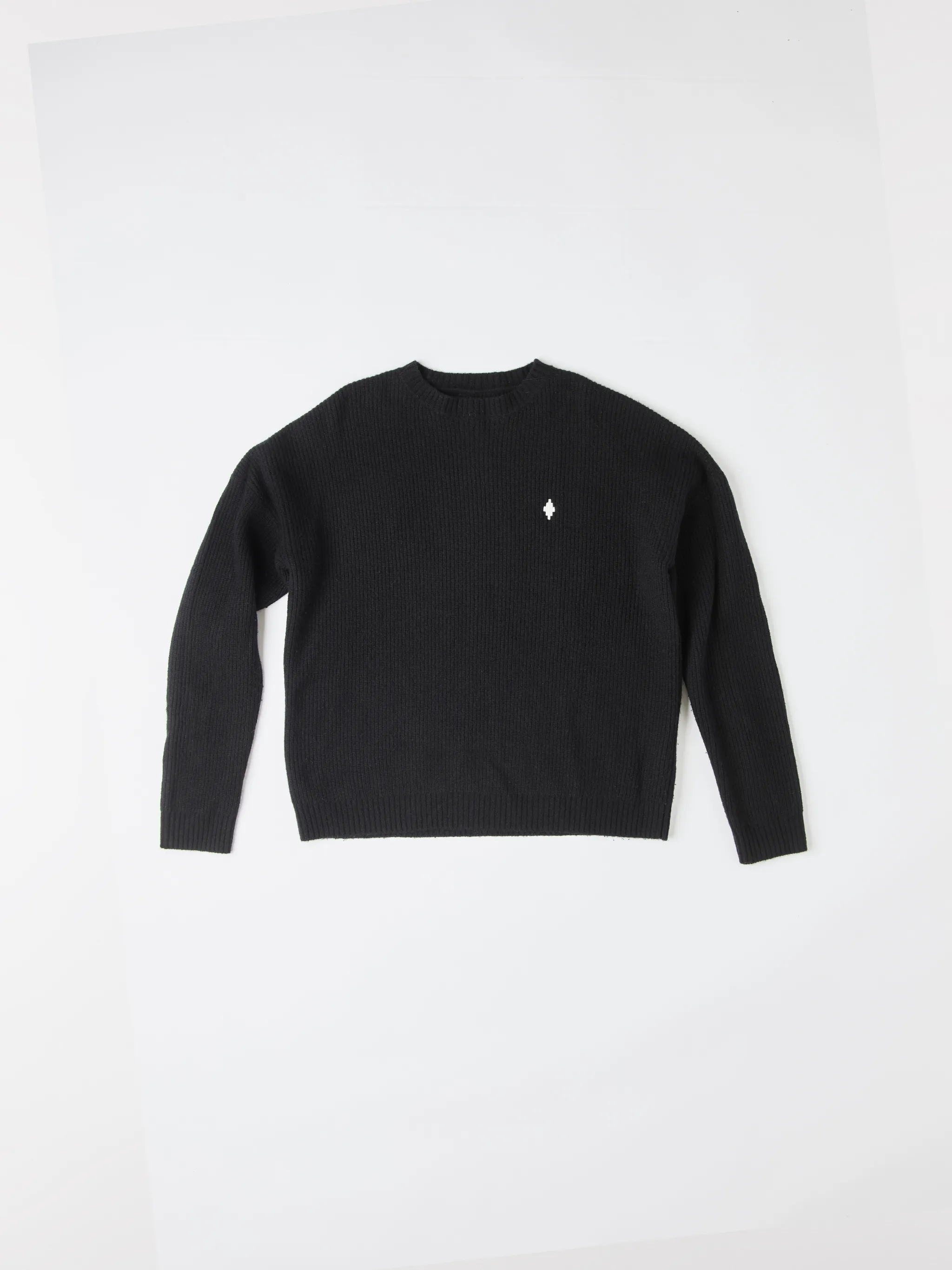 Black wool MBCM ribbed-knit wool jumper from Marcelo Burlon County of Milan featuring chunky ribbed knit, embroidered logo at the chest, embroidered logo to the rear, ribbed edge, crew neck, long sleeves and straight hem.