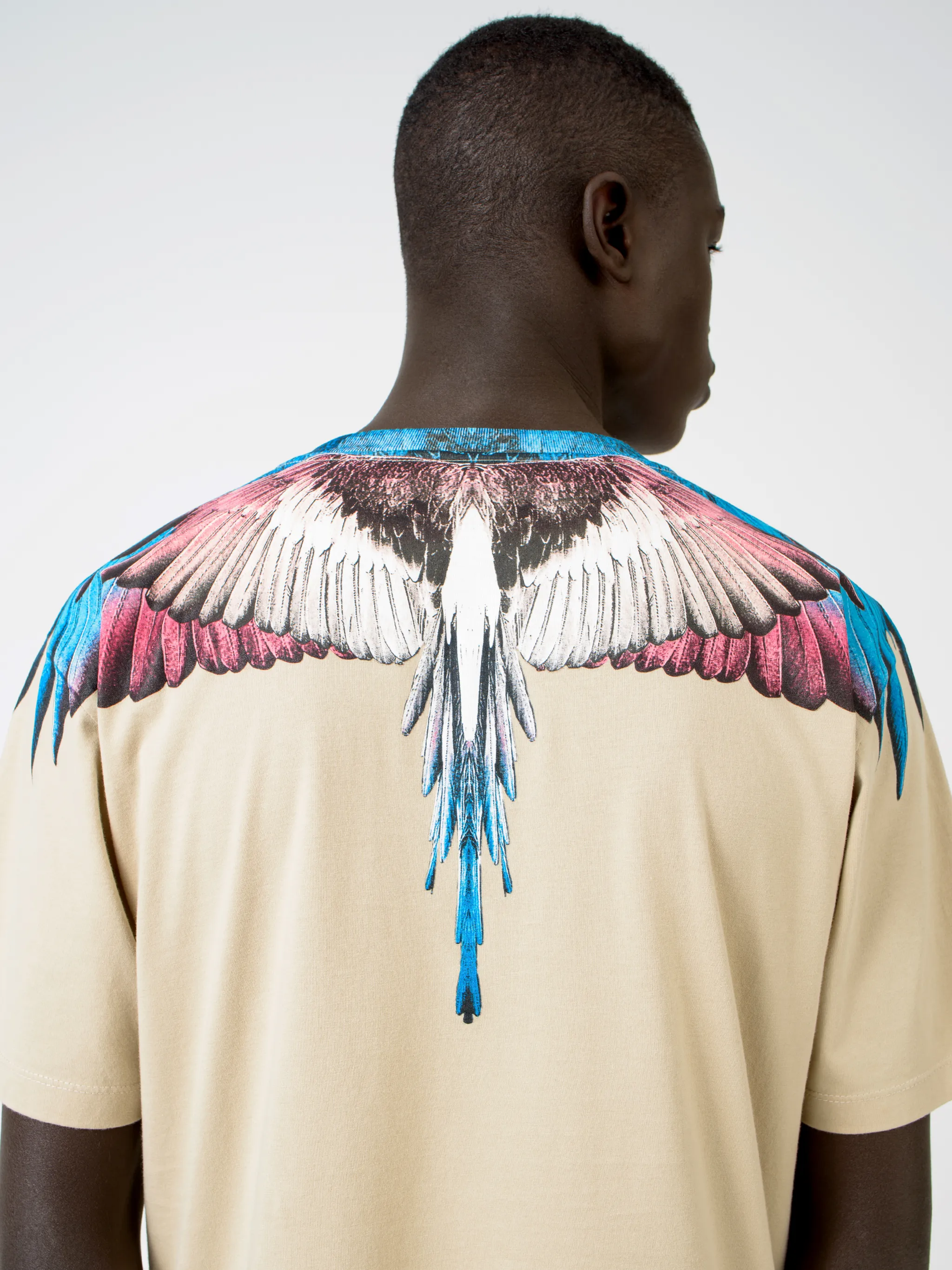 Beige cotton Wings T-shirt from Marcelo Burlon County of Milan featuring round neck and short sleeves.