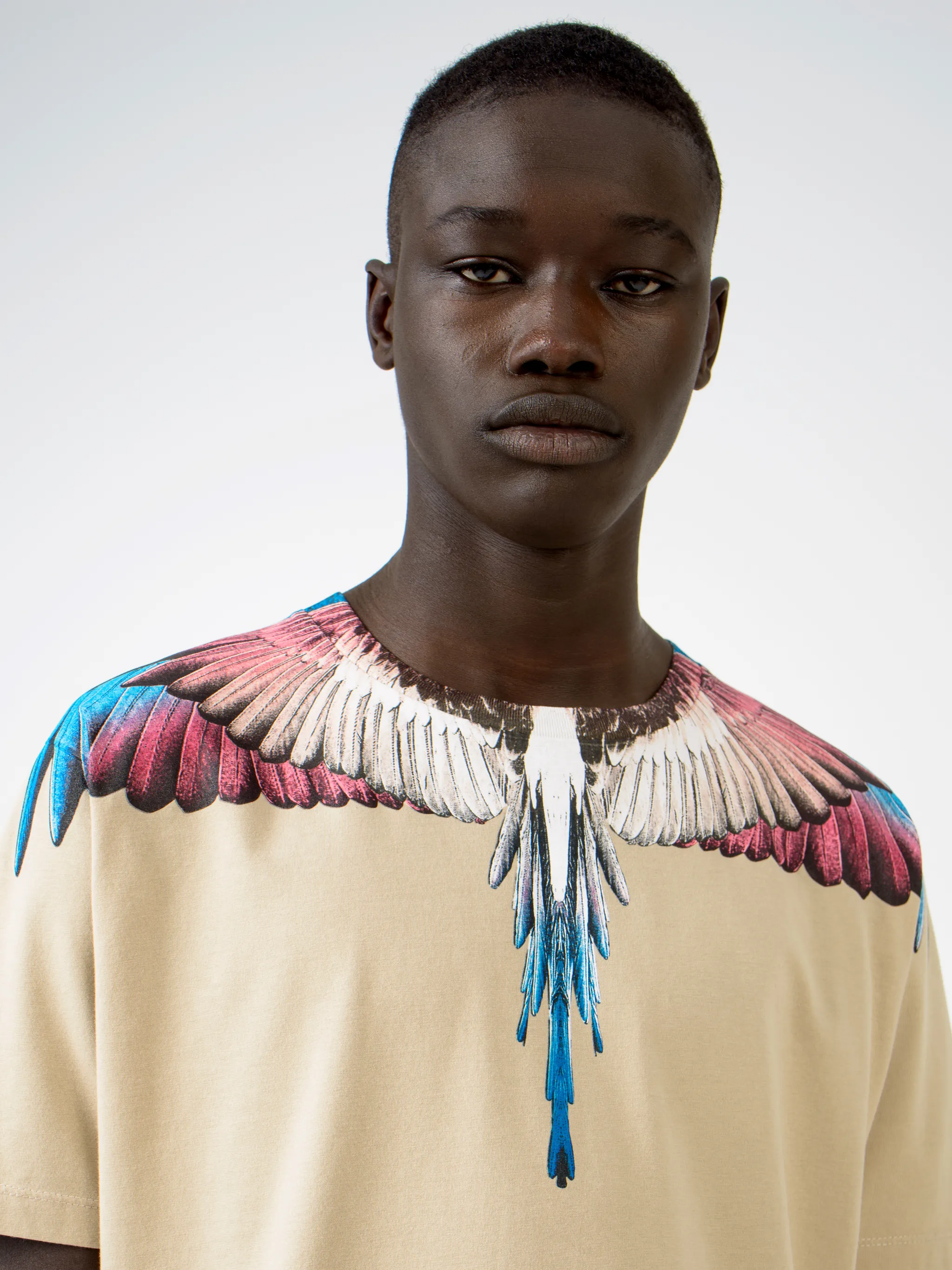 Beige cotton Wings T-shirt from Marcelo Burlon County of Milan featuring round neck and short sleeves.