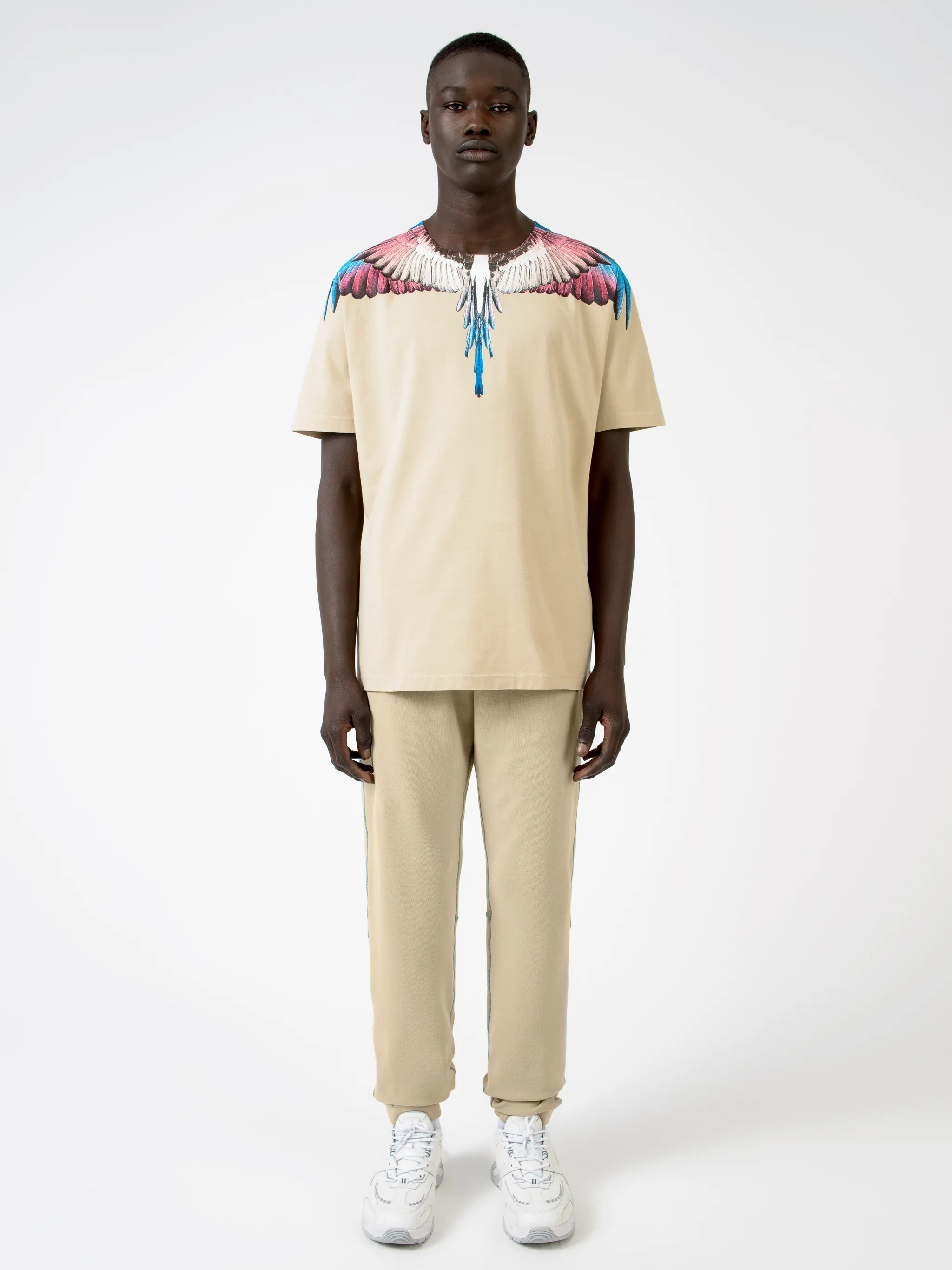 Beige cotton Wings T-shirt from Marcelo Burlon County of Milan featuring round neck and short sleeves.