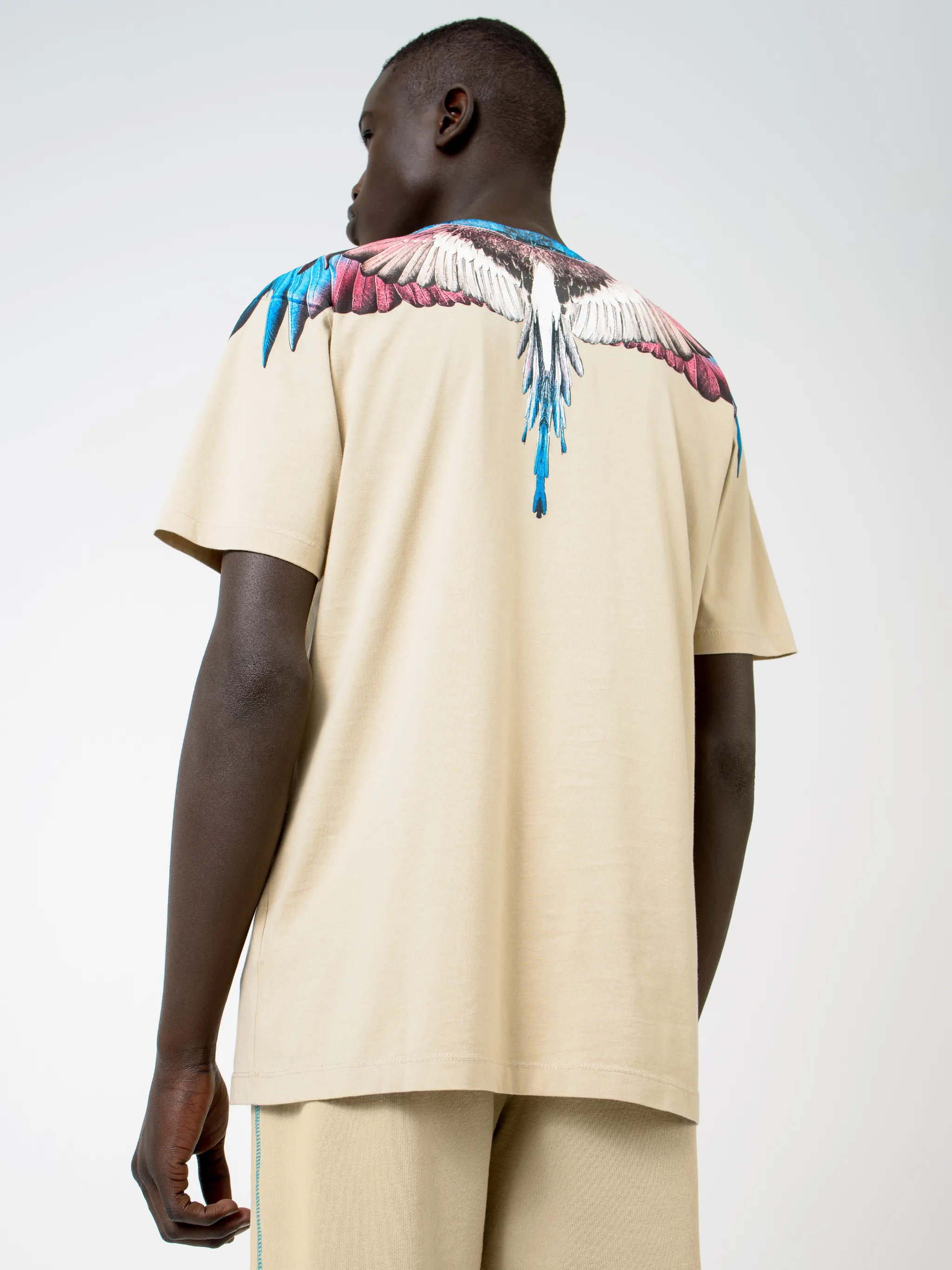Beige cotton Wings T-shirt from Marcelo Burlon County of Milan featuring round neck and short sleeves.