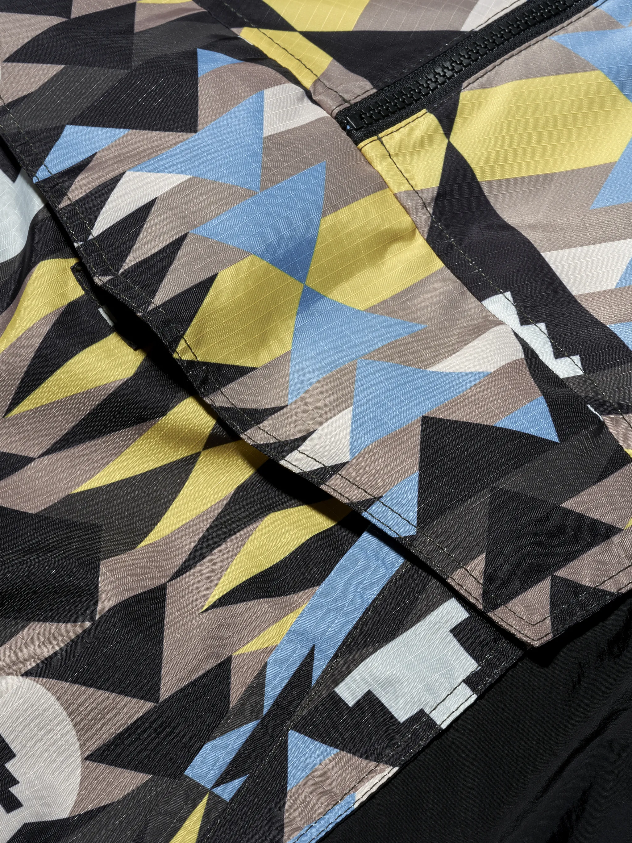 Multicolour geometric-print hooded coat from Marcelo Burlon County of Milan featuring drawstring hood, geometric print, front zip fastening, chest flap pocket and long sleeves.