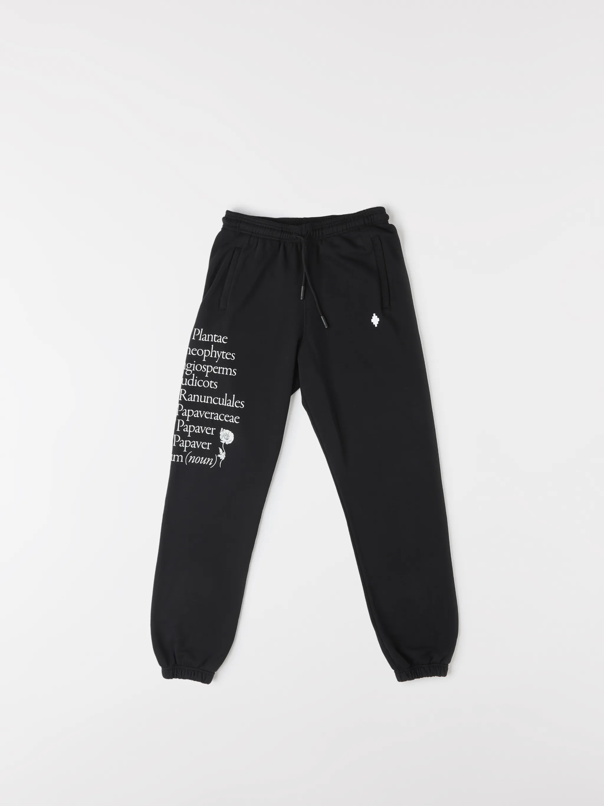 Black cotton Papaver tapered track pants from Marcelo Burlon County of Milan featuring embroidered logo to the front, slogan print, elasticated ankles, elasticated waistband, drawstring fastening, tapered design, two side slit pockets and rear welt pocket.