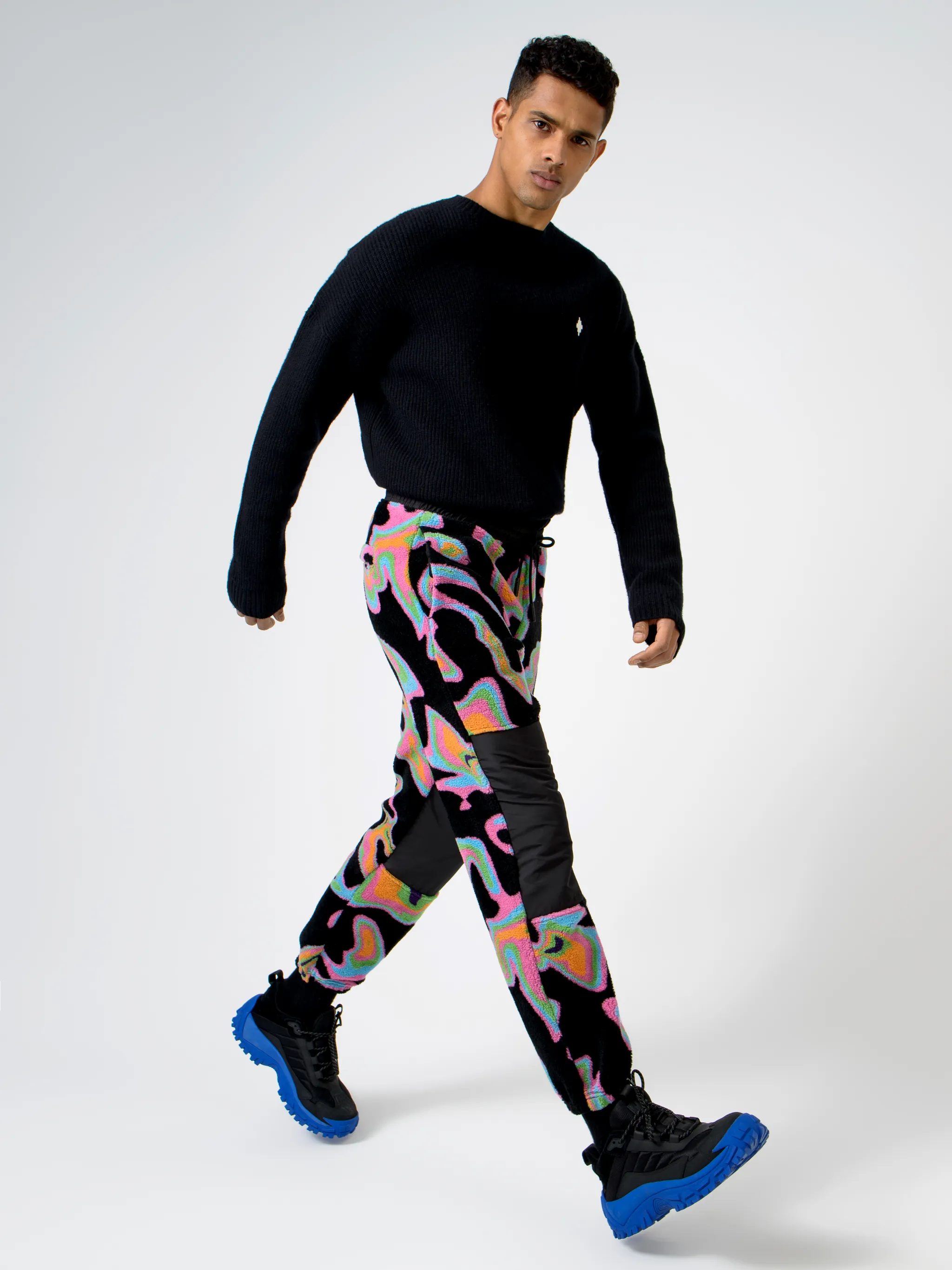 Black/multicolour intarsia Psych pattern track pants from Marcelo Burlon County of Milan featuring patterned intarsia knit, elasticated waistband, drawstring fastening, two side patch pockets, contrasting panel detail and elasticated ankles.