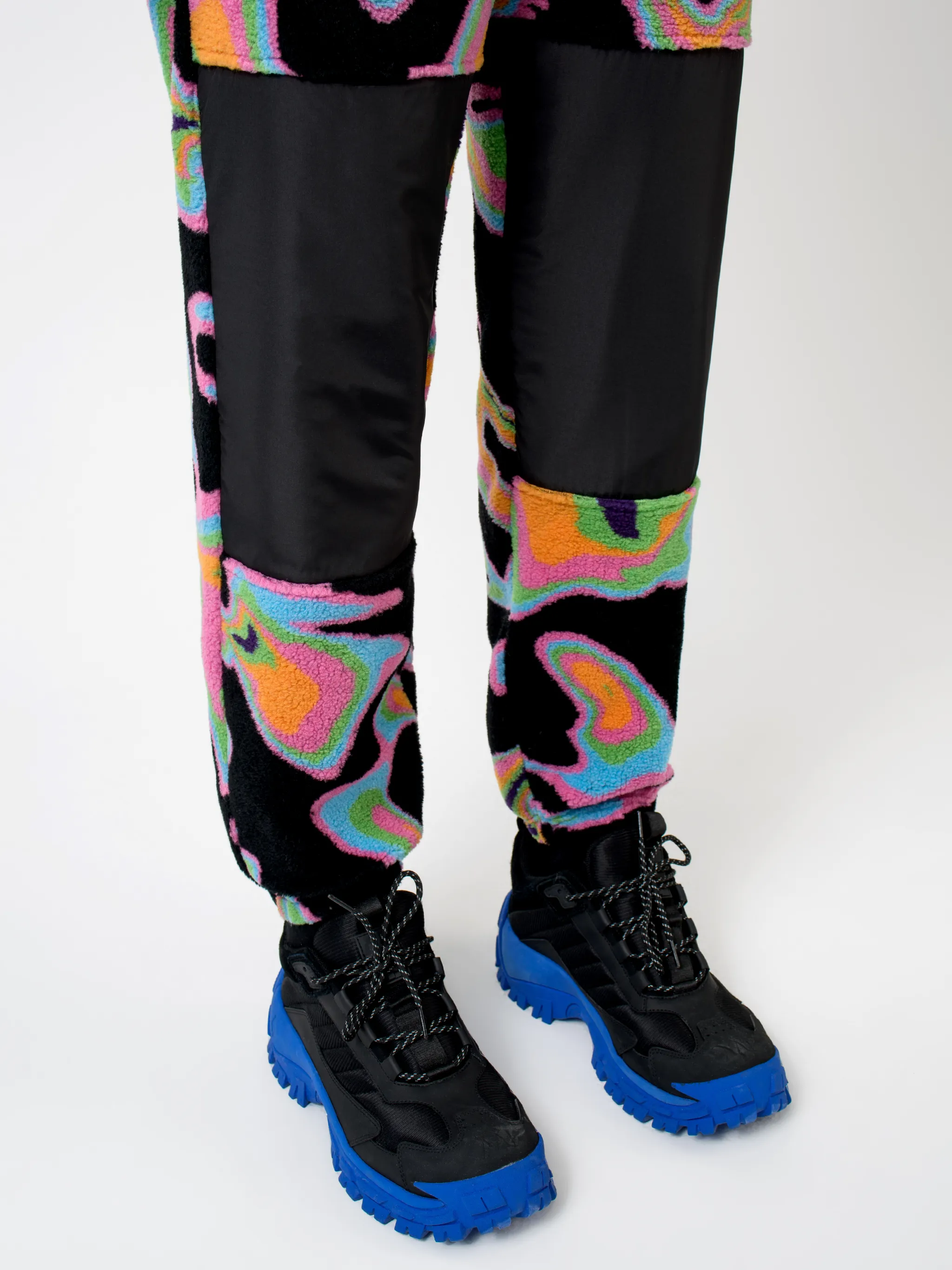 Black/multicolour intarsia Psych pattern track pants from Marcelo Burlon County of Milan featuring patterned intarsia knit, elasticated waistband, drawstring fastening, two side patch pockets, contrasting panel detail and elasticated ankles.