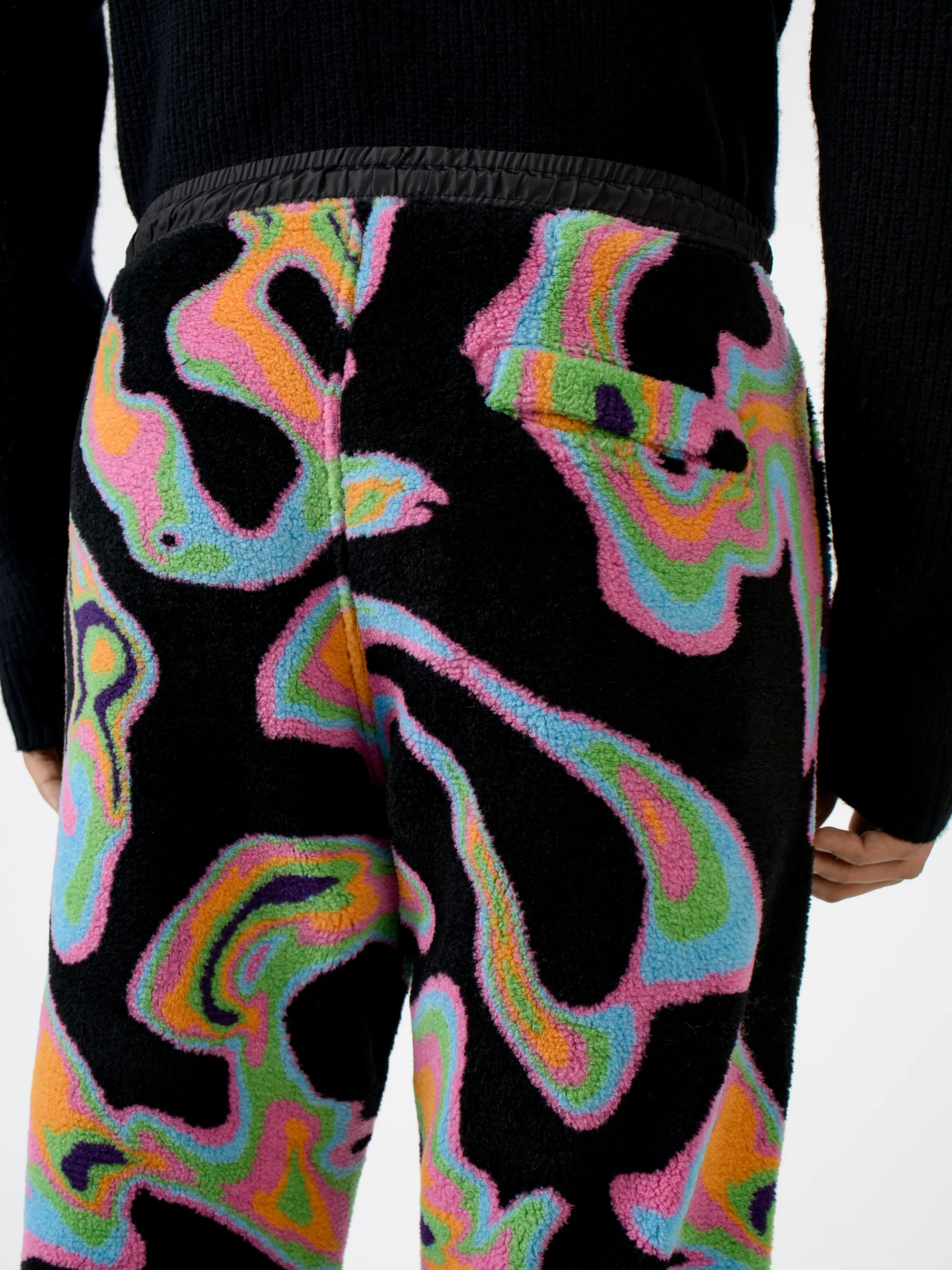 Black/multicolour intarsia Psych pattern track pants from Marcelo Burlon County of Milan featuring patterned intarsia knit, elasticated waistband, drawstring fastening, two side patch pockets, contrasting panel detail and elasticated ankles.