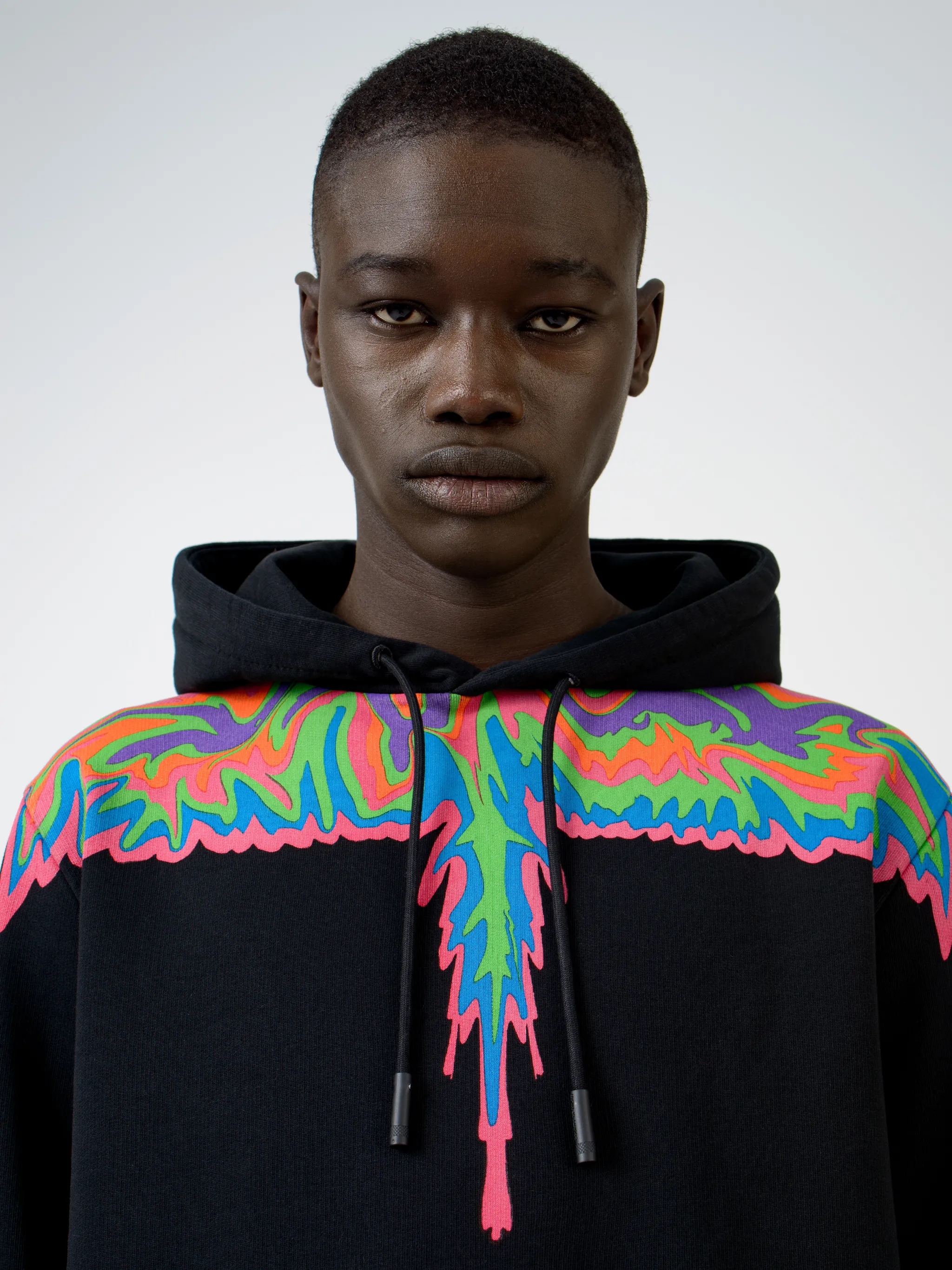 Black multicolour cotton psychedelic drip cotton hoodie from Marcelo Burlon County of Milan featuring drawstring hood.