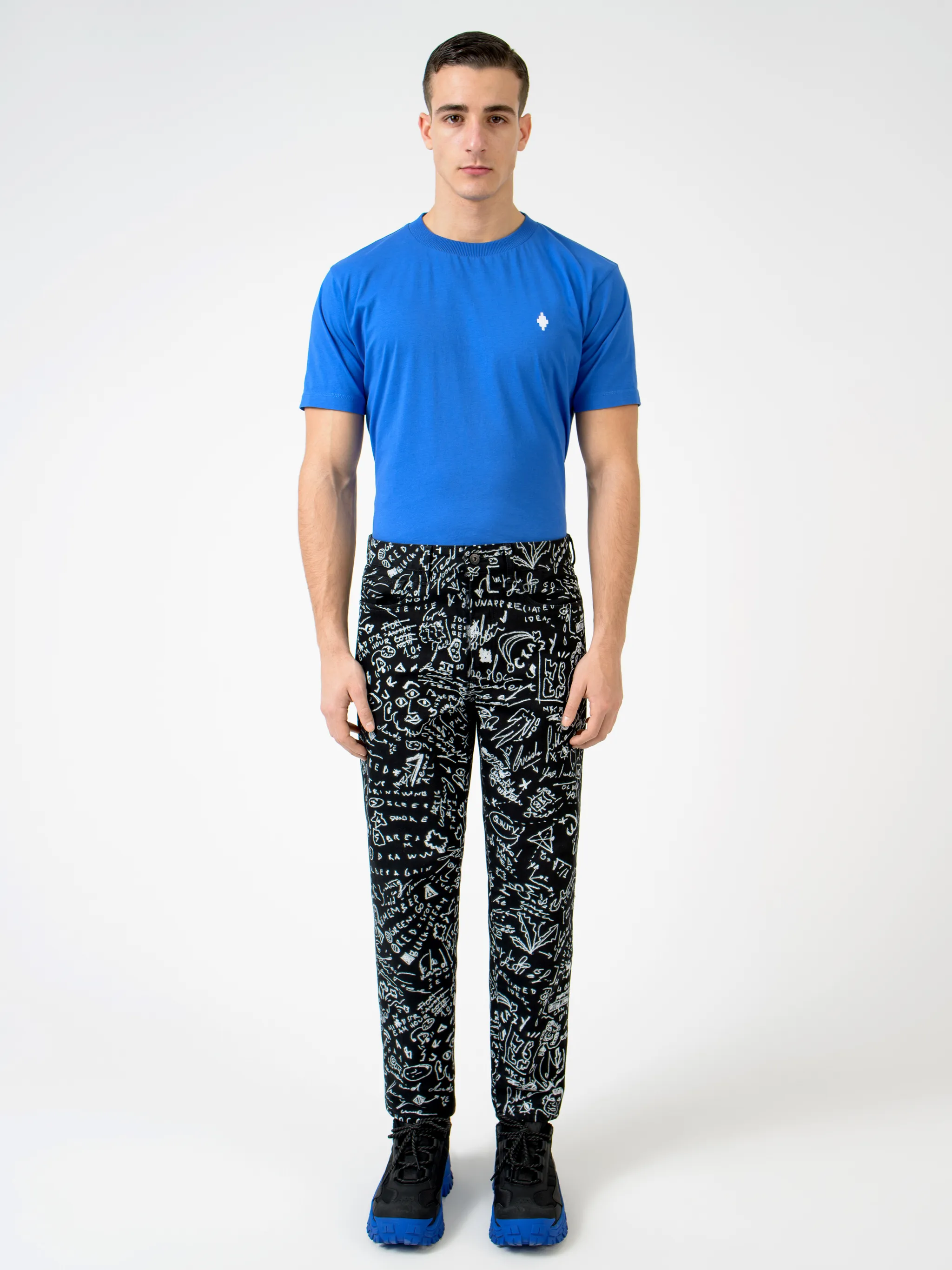 Black/white cotton-blend sketches print slim-fit jeans from Marcelo Burlon County of Milan featuring all-over logo print, slim cut, belt loops, front button fastening and tonal stitching.