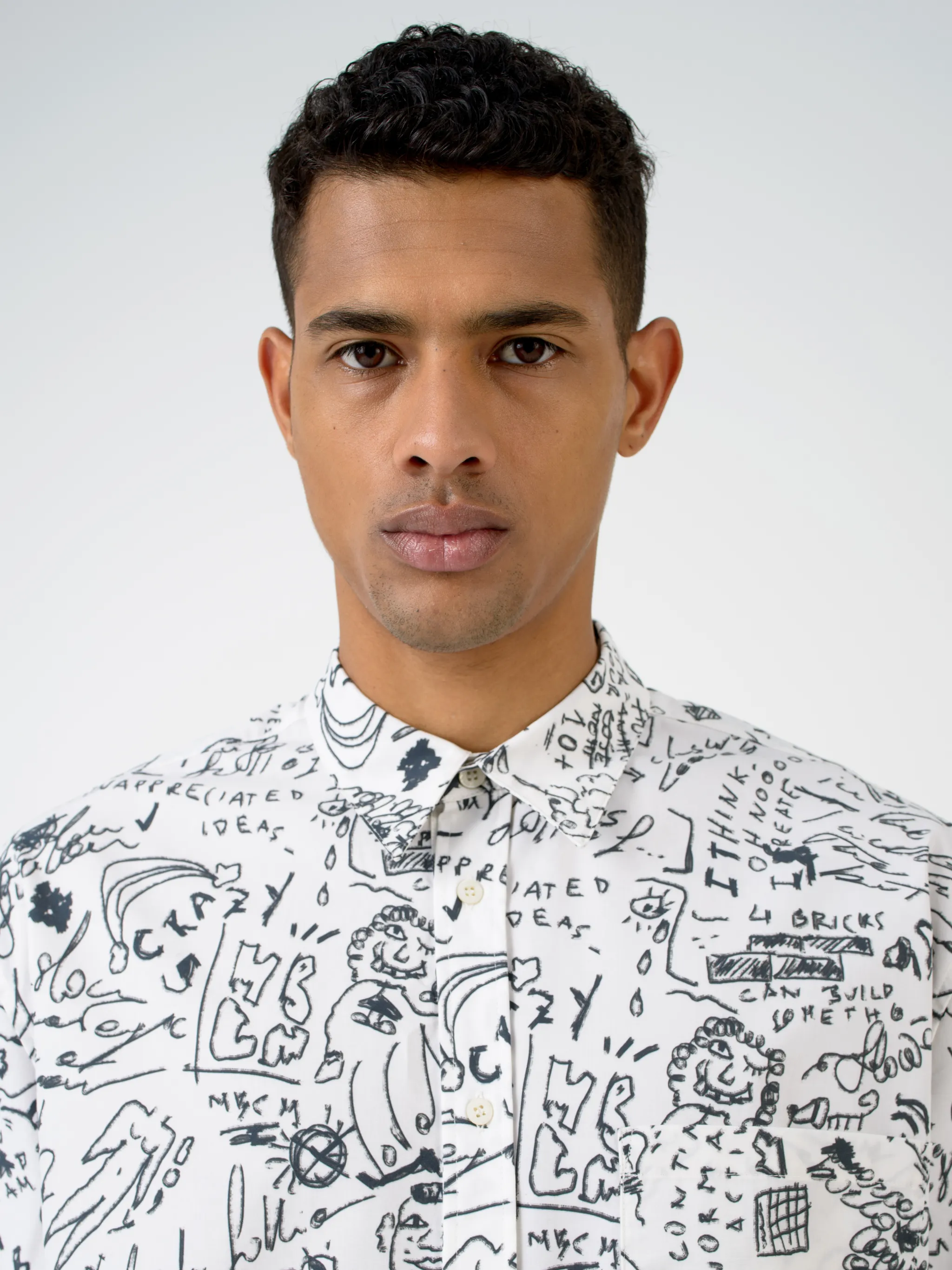 White cotton Sketches long-sleeve shirt from Marcelo Burlon County of Milan featuring classic collar, front button fastening, long sleeves, chest patch pocket, buttoned cuffs, curved hem and all-over sketches pattern.