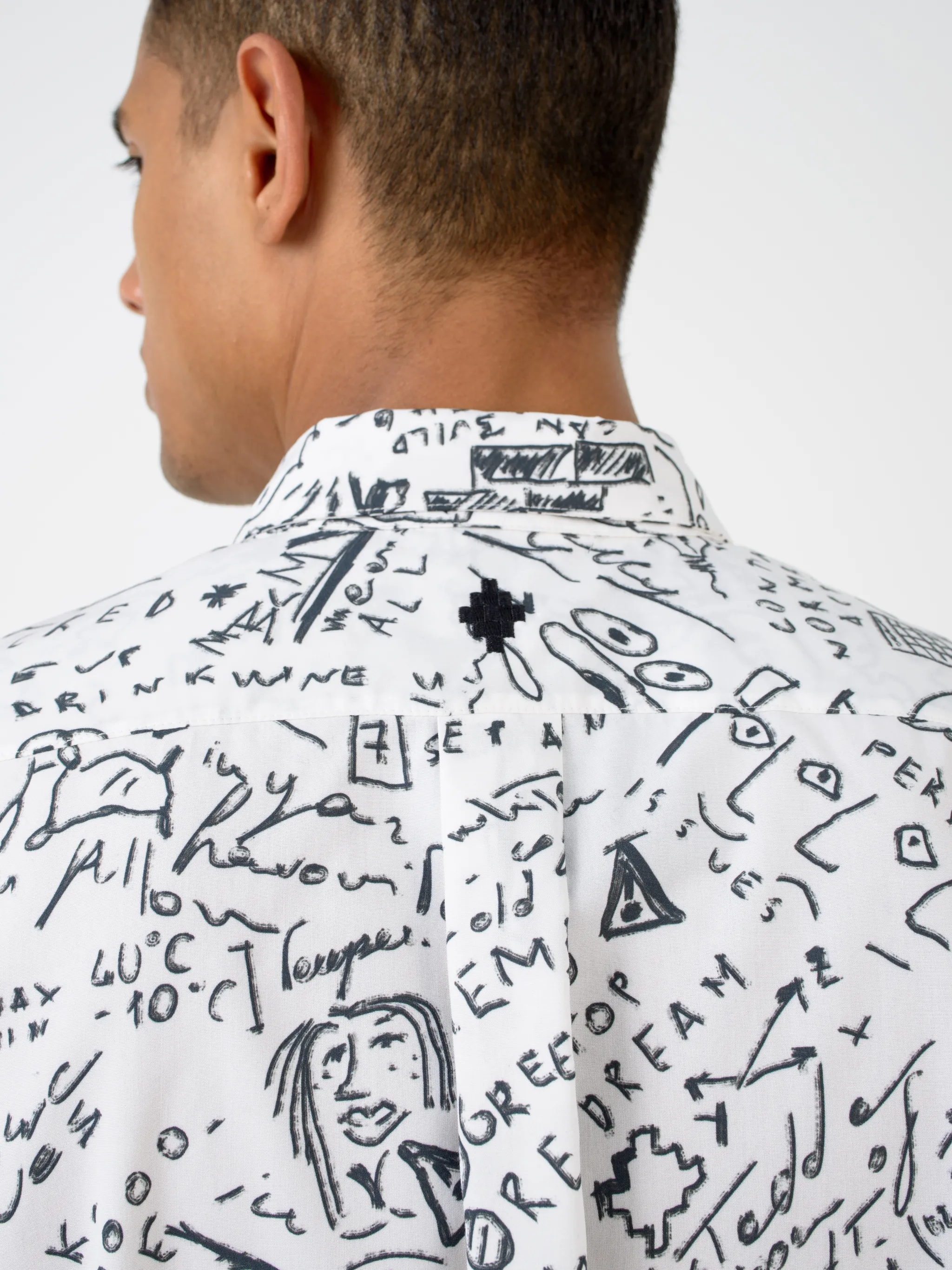 White cotton Sketches long-sleeve shirt from Marcelo Burlon County of Milan featuring classic collar, front button fastening, long sleeves, chest patch pocket, buttoned cuffs, curved hem and all-over sketches pattern.