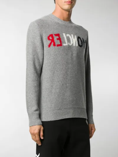 grey branded jumper