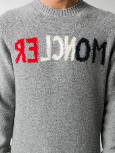 grey branded jumper