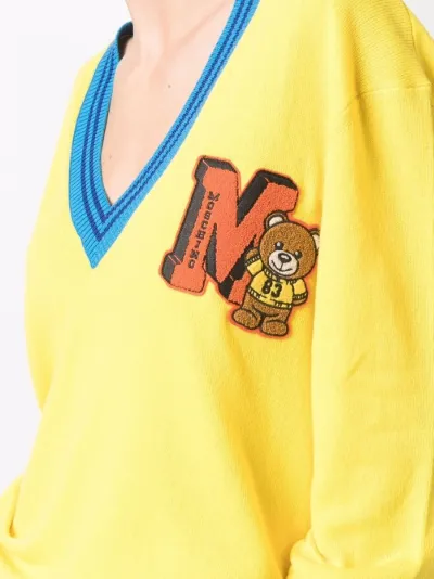 yellow moschino jumper