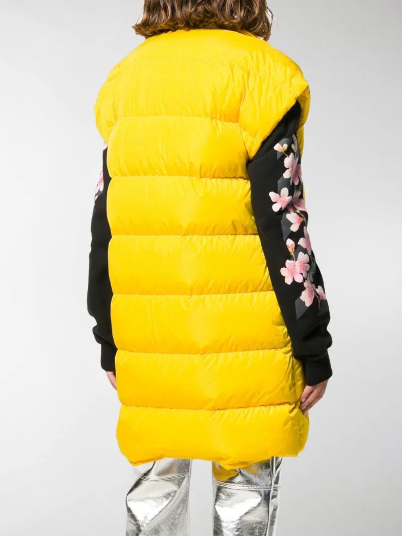 yellow sleeveless puffer jacket