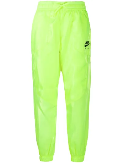 green nike track pants