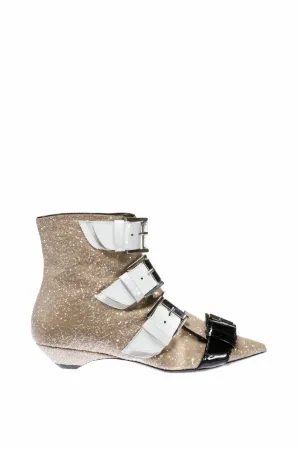 buckled glitter and patent-leather boots