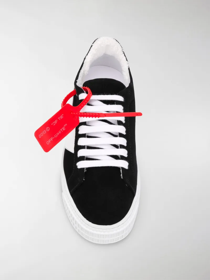 sneakers with arrow logo