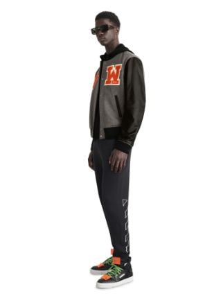 Off-White c/o Virgil Abloh - Off-White™ c/o AC Milan the capsule revolves  around a gray Varsity jacket with graphic patches, including the Off-White™  diagonal on the right sleeve and the AC Milan “