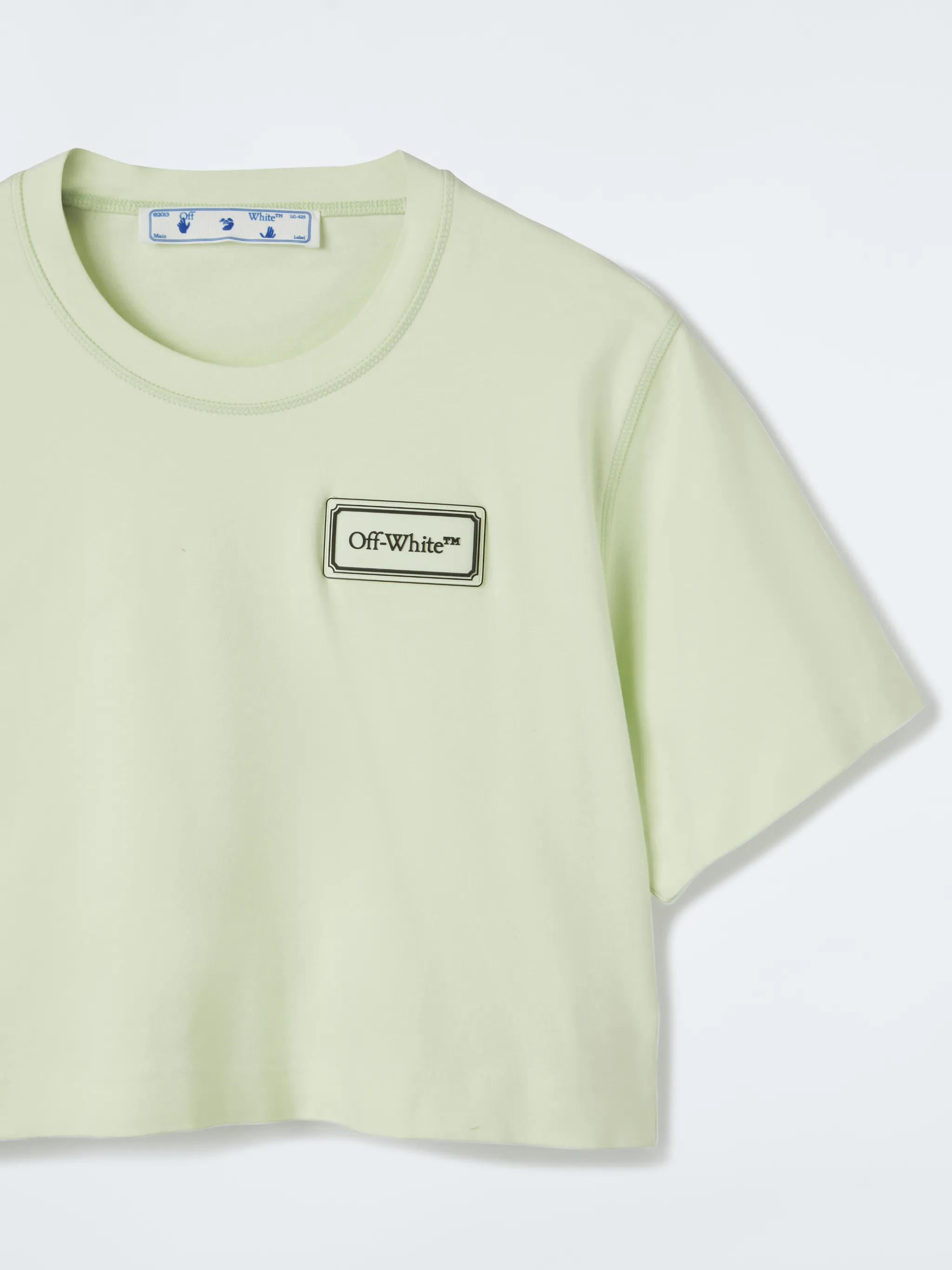 off white green and black shirt