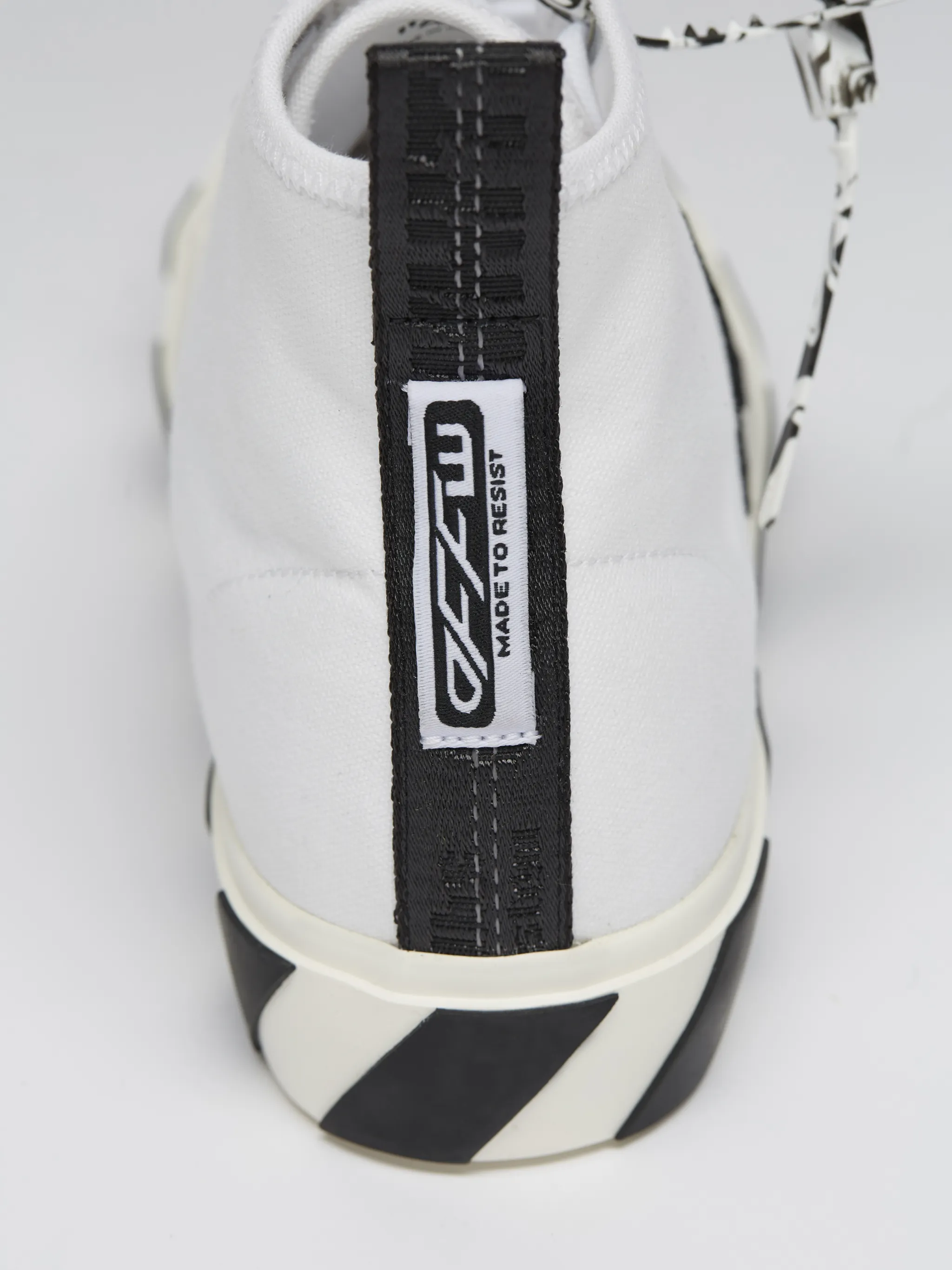 off white mid top vulcanized sneaker