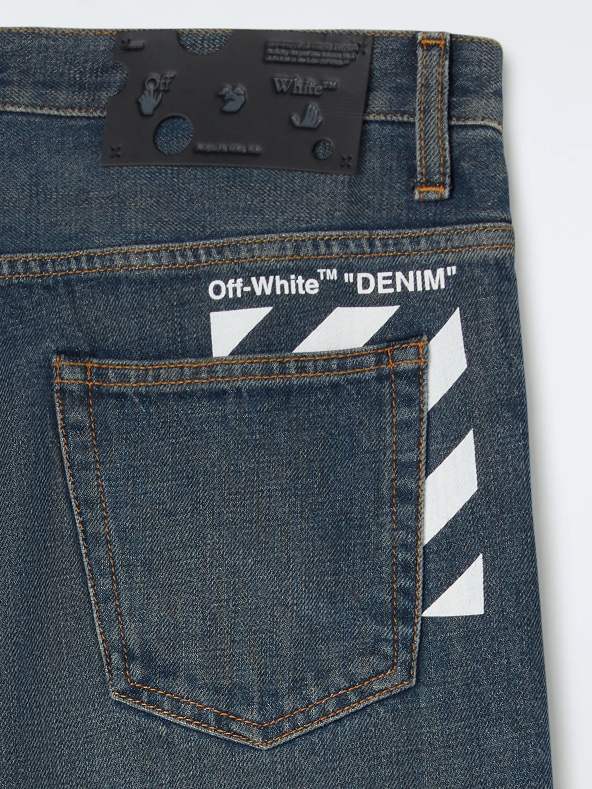 PANTALONI IN DENIM CON STRISCE OBLIQUE
