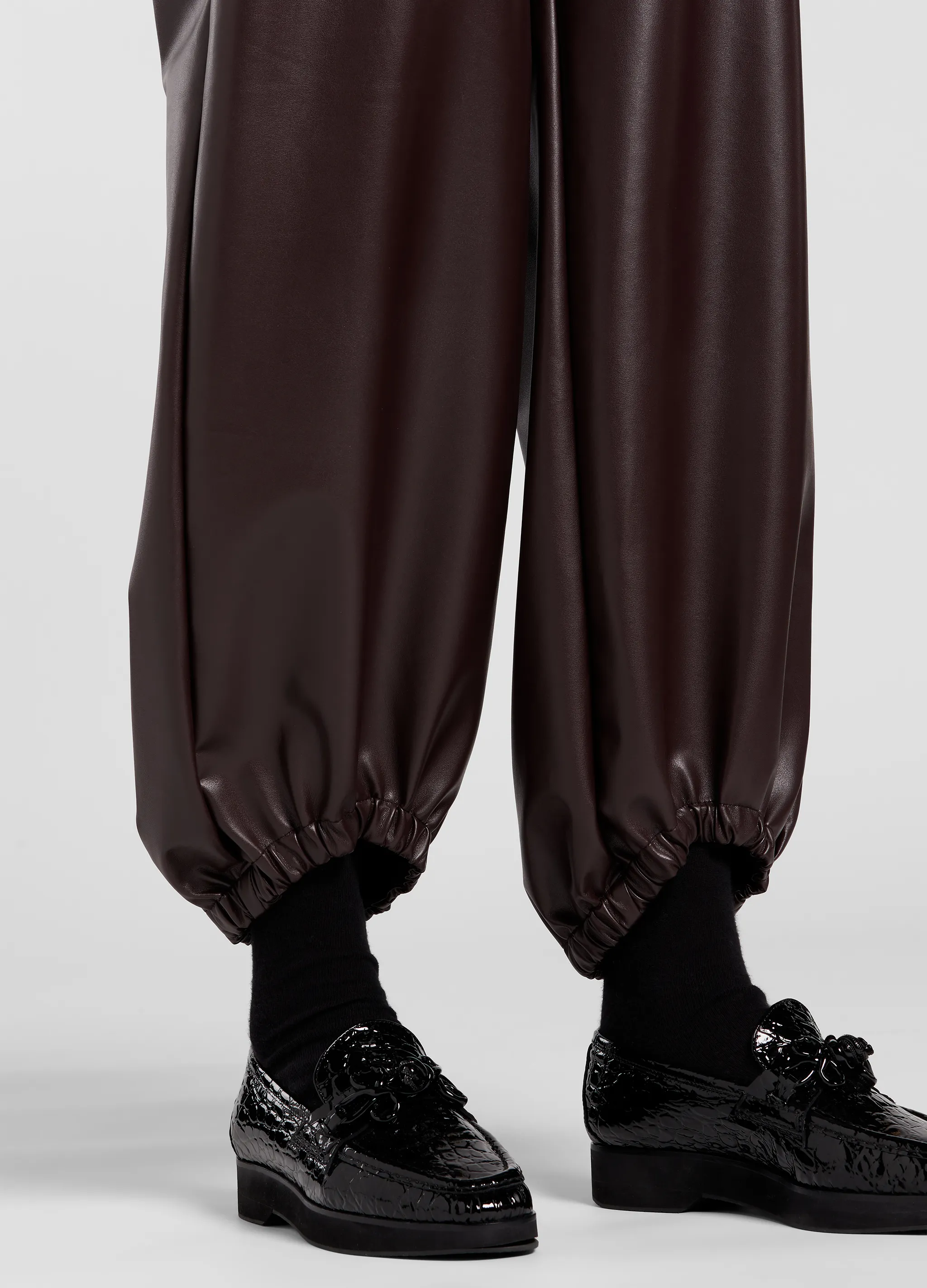 FAUX LEATHER GATHERED PANTS