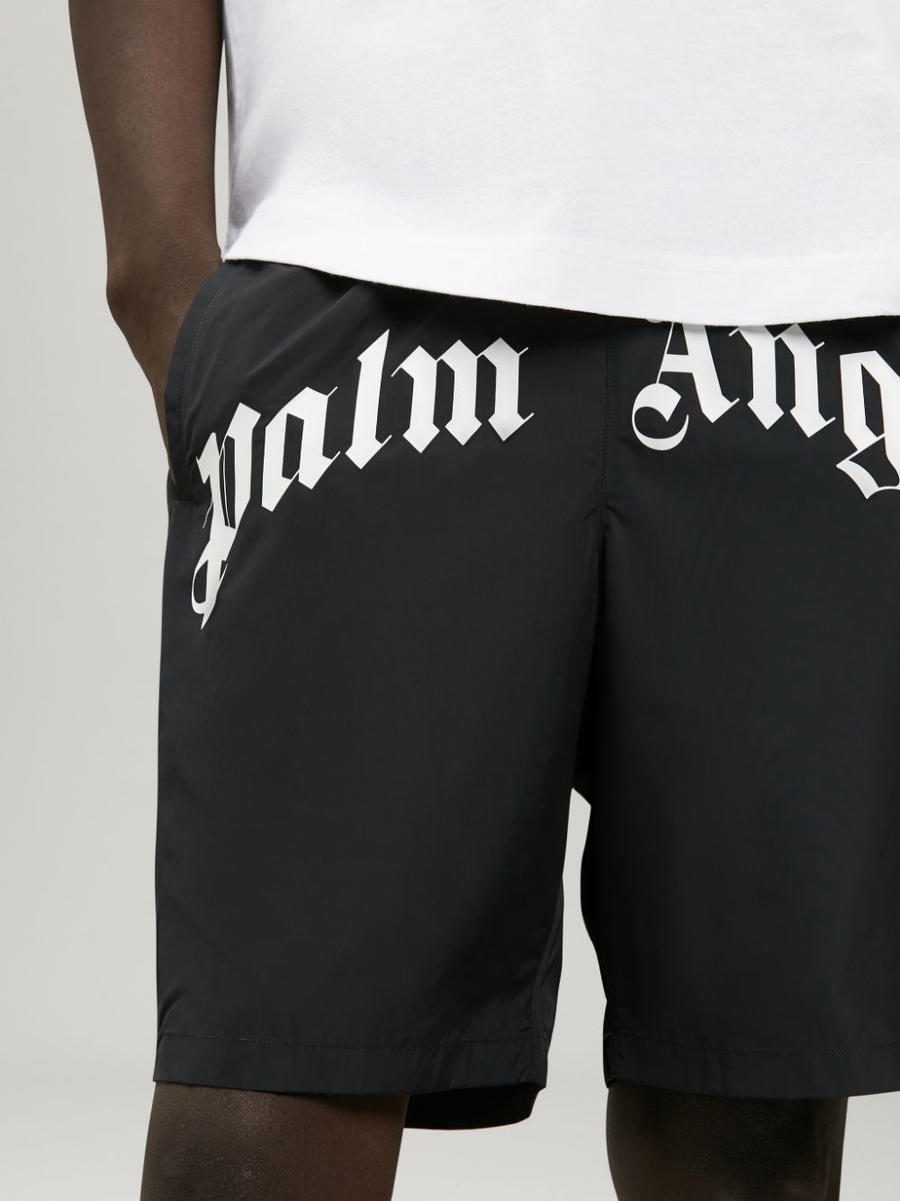 curved logo swimming shorts in black - Palm Angels® Official