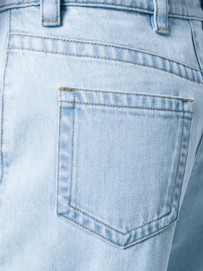 Prada Jeans con piume blu | MODES