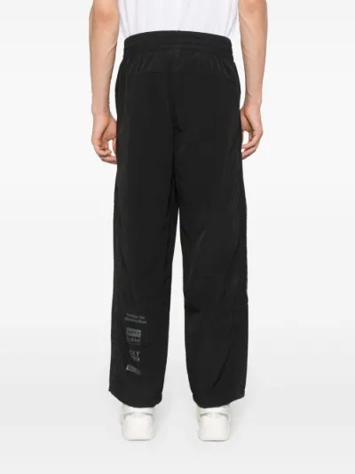 PUMA x Pleasures logo print trousers Eraldo UK