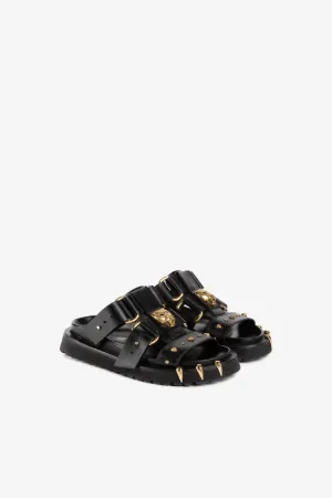 Klobige Sandalen mit Pantherkopf