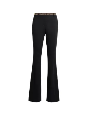 pantalones acampanados con apliques