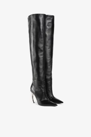 Schenkelhohe Lederstiefel mit Tigerzahn