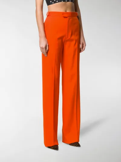 orange high waisted trousers