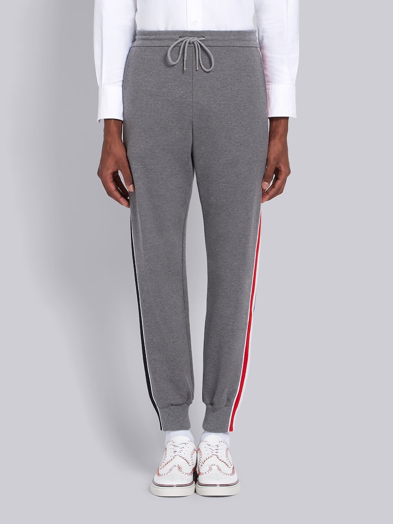 grey pants with red stripe