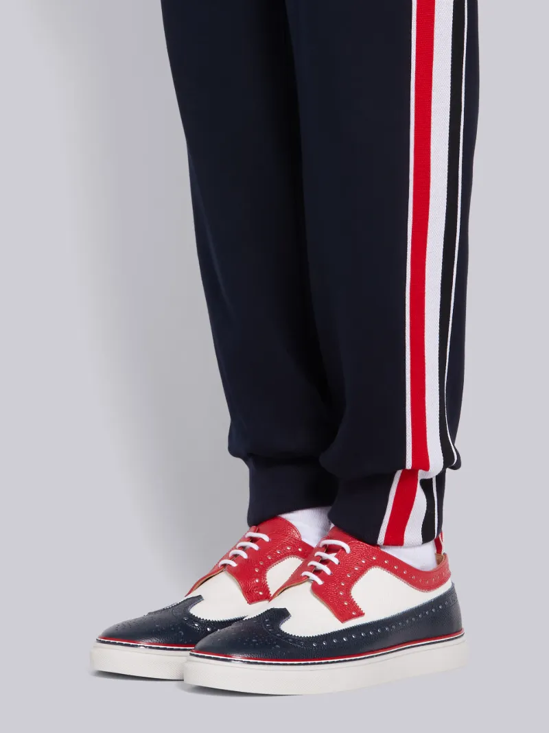 Navy Cotton Interlocking RWB Stripe Track Pants | Thom Browne