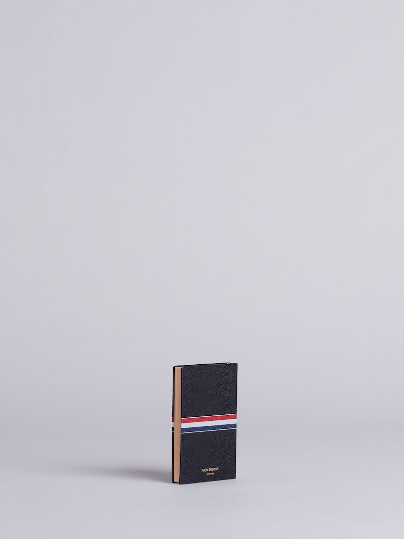 small tricolour notebook