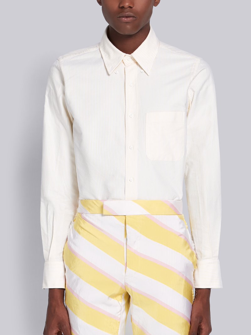 yellow shirt with red stripe