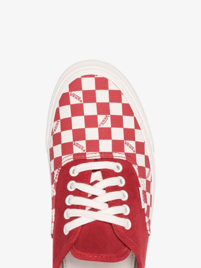 red and white low top vans