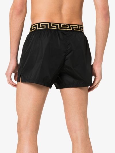 Versace Greca border swim shorts | Browns
